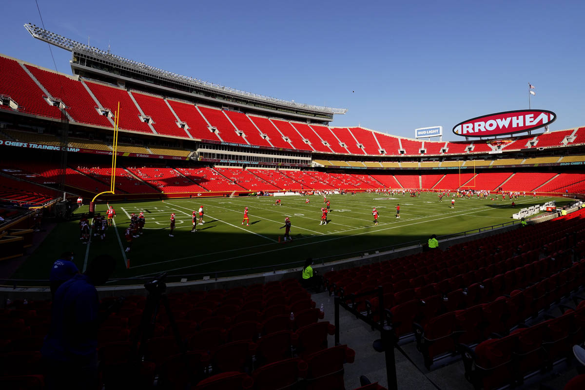 Socially distanced fans watch the Kansas City Chiefs during an NFL football training camp Satur ...