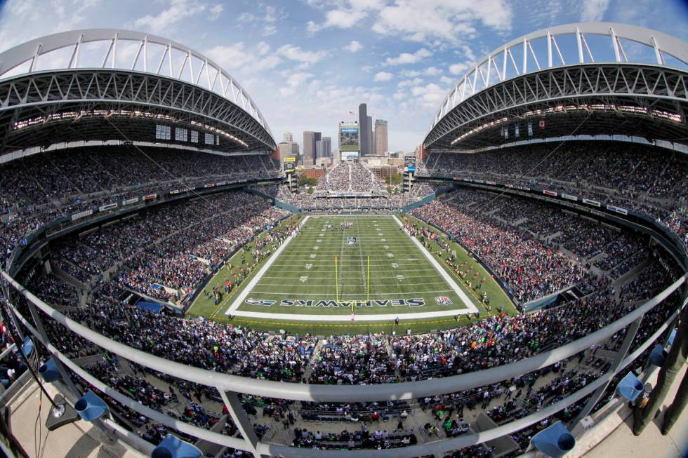 In this Oct. 2, 2011, file photo, taken with a fisheyelens, the Seattle Seahawks and Atlanta Fa ...