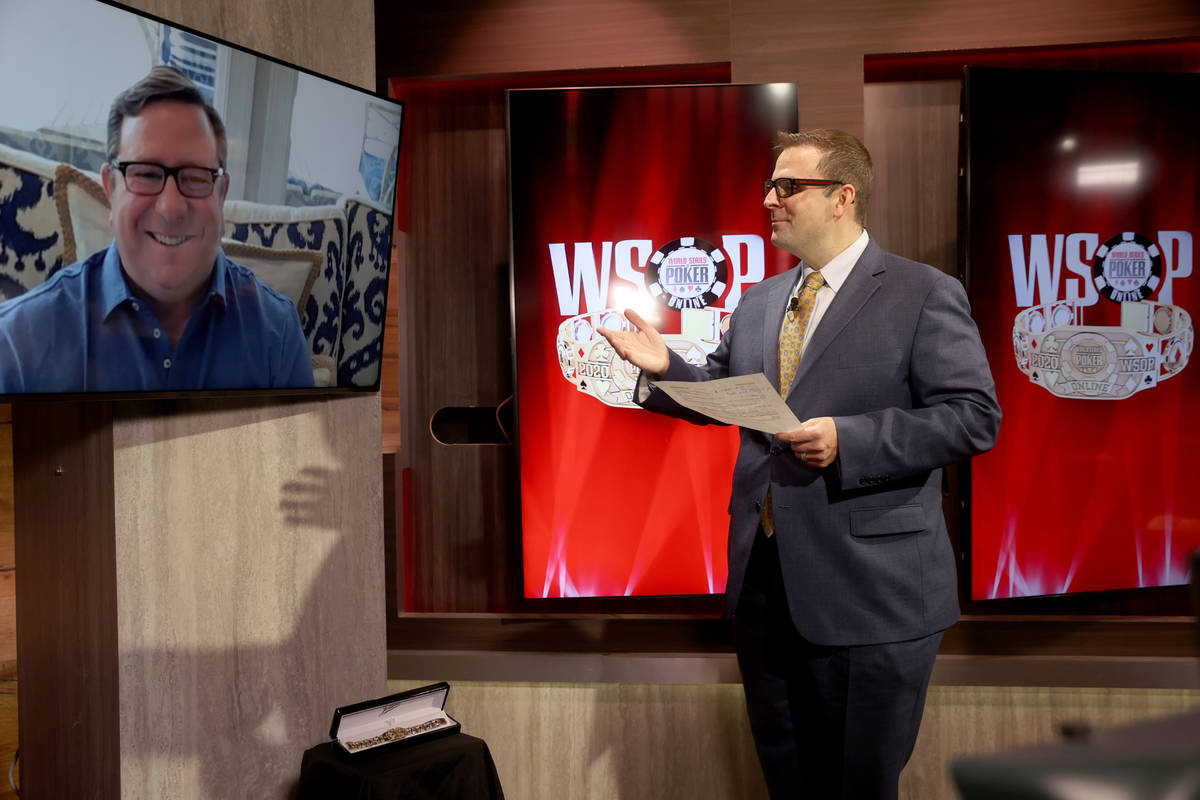 Jack Effel, World Series of Poker vice president, presents Jonathan Lessin a bracelet for winni ...