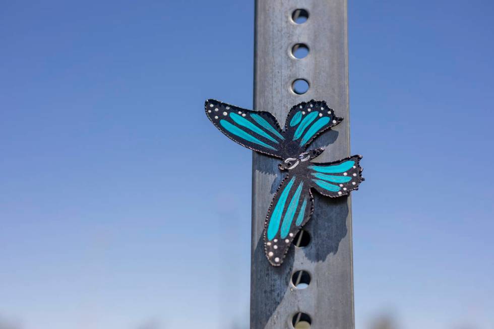 A metal butterfly created by Isaias Urrabazo, a local artist, is pictured in the parking of Mou ...