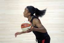Las Vegas Aces guard Lindsay Allen pushes the ball up the court during the first half of a WNBA ...