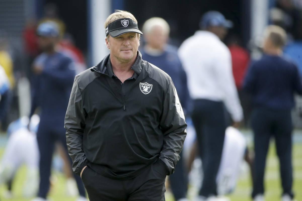 Oakland Raiders head coach Jon Gruden watches during warm ups before an NFL football game again ...