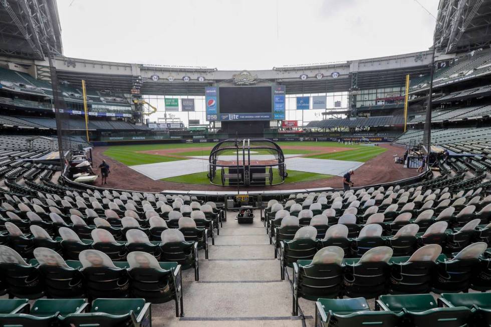 FILE - In this Friday, July 31, 2020, file photo, fan cutouts sit in seats behind home plate at ...