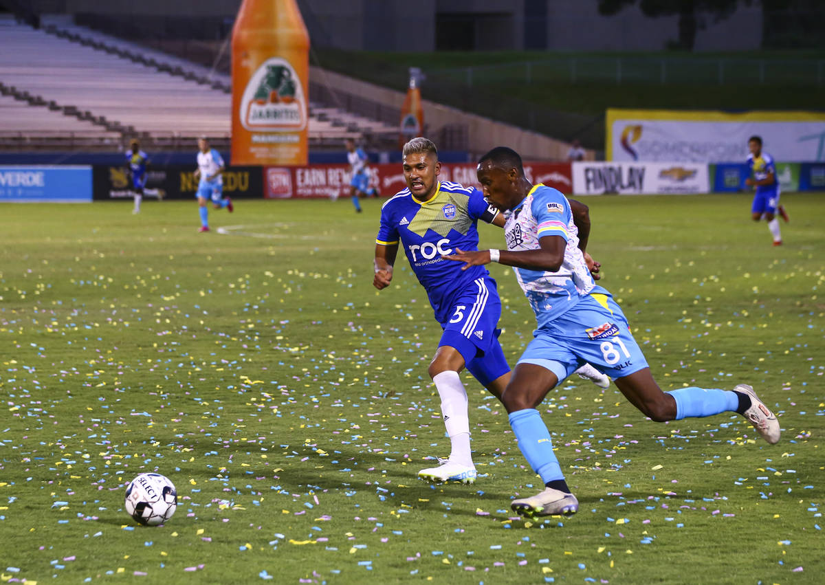 Las Vegas Lights FC's Rashawn Dally (81) chases after the ball against Reno 1868 FC's Tony Alfa ...