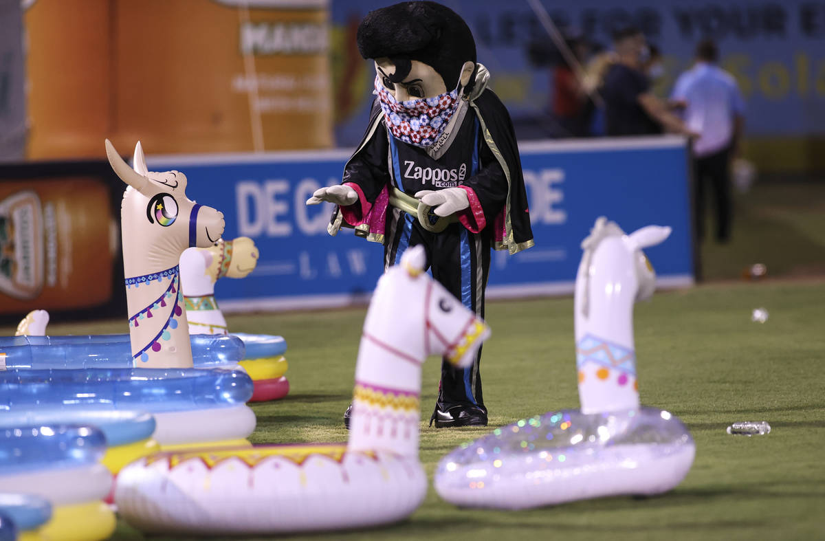 Las Vegas Lights FC mascot Cash interacts with blowup llamas during the second half of a USL so ...