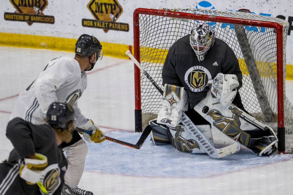 Vegas Golden Knights center Paul Stastny (26, left) has a shot stopped by goaltender Robin Lehn ...