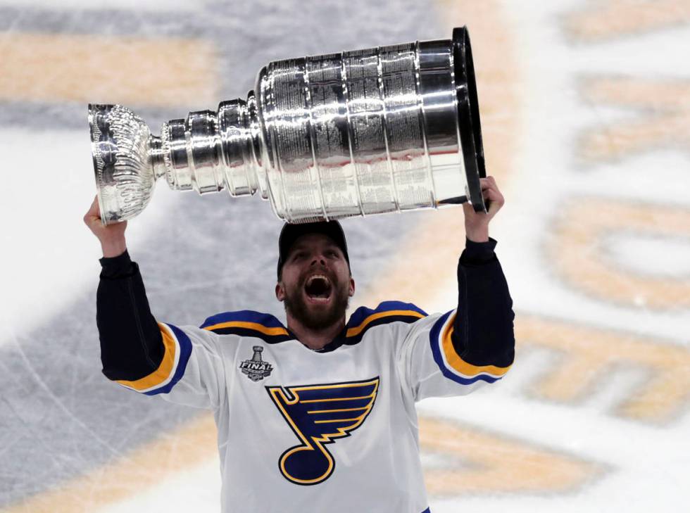 St. Louis Blues' David Perron carries the Stanley Cup after the Blues defeated the Boston Bruin ...