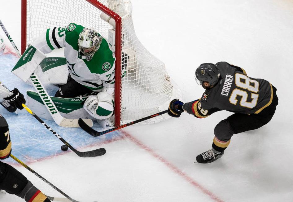 Dallas Stars goalie Ben Bishop (30) makes the save on Vegas Golden Knights' William Carrier (28 ...