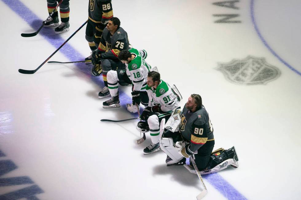 Dallas Stars' Jason Dickinson (18), Tyler Seguin (91) and Vegas Golden Knights' Ryan Reaves (75 ...