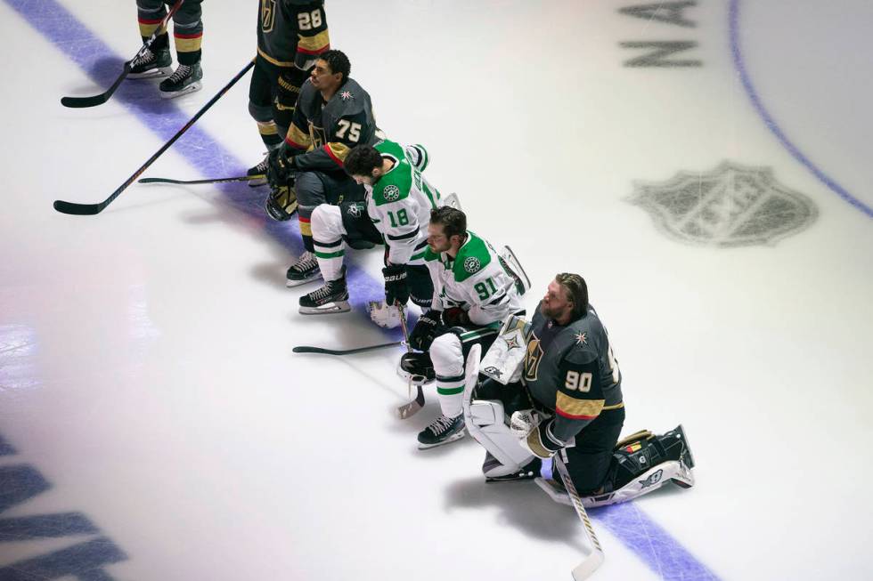 Dallas Stars' Jason Dickinson (18), Tyler Seguin (91) and Vegas Golden Knights' Ryan Reaves (75 ...