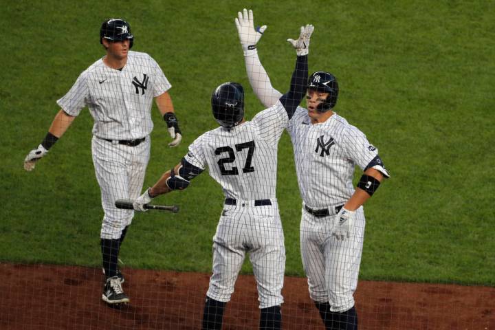 New York Yankees' Aaron Judge, right, celebrates his two-run home run with Giancarlo Stanton (2 ...