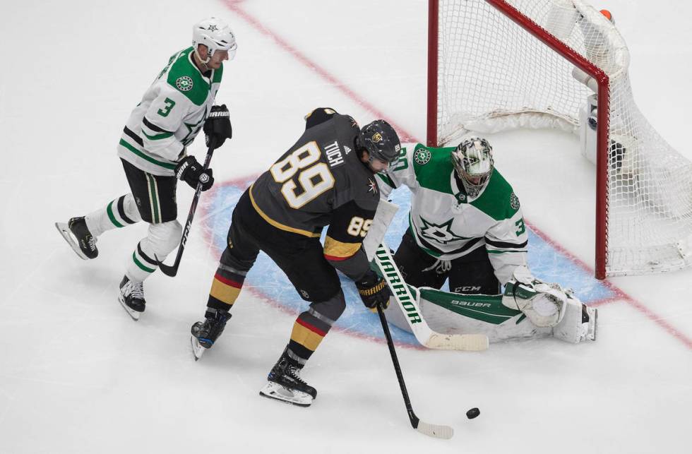 Dallas Stars goalie Ben Bishop (30) makes the save on Vegas Golden Knights' Alex Tuch (89) as S ...