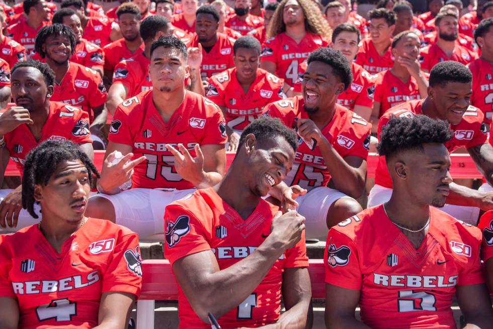 UNLV football players get into place during the team's photo day at Sam Boyd Stadium in Las Veg ...