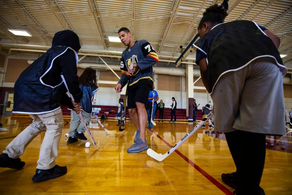 Golden Knights forward Ryan Reaves helps lead a youth street hockey clinic at Doolittle Recreat ...