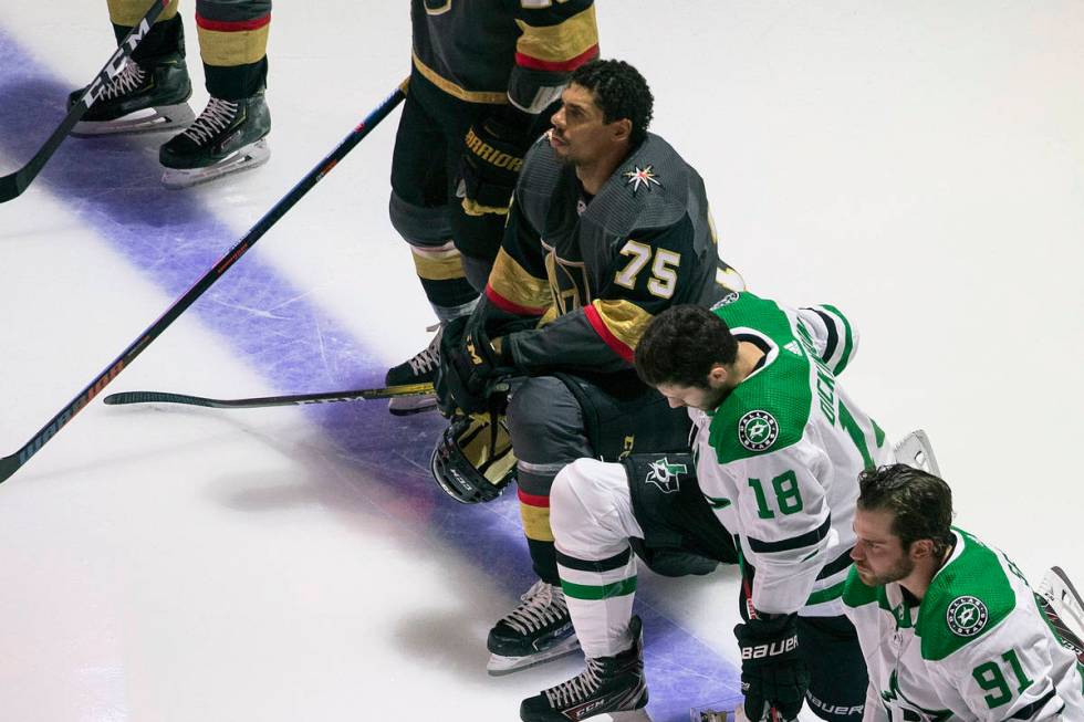 The Golden Knights' Ryan Reaves (75) is shown kneeling during the national anthems before an NH ...