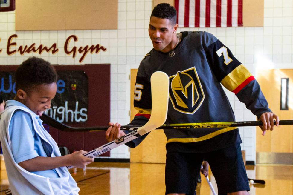 Golden Knights forward Ryan Reaves shows Javon Williams, 9, how to celebrate after scoring a go ...