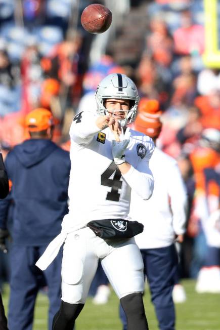 Oakland Raiders quarterback Derek Carr (4) throws the football during warm up drills before an ...