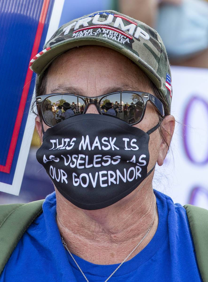 One on many protestors gathered at the Grant Sawyer building to voice opposition against AB4, a ...