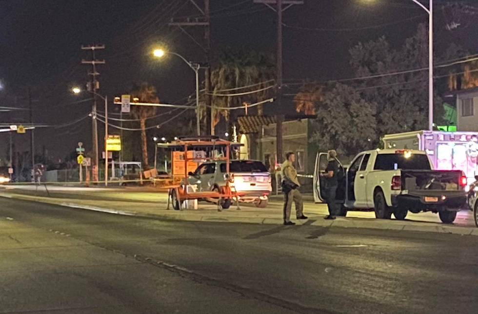 Police detectives investigate a double homicide in the 700 block of North Eastern Avenue near M ...