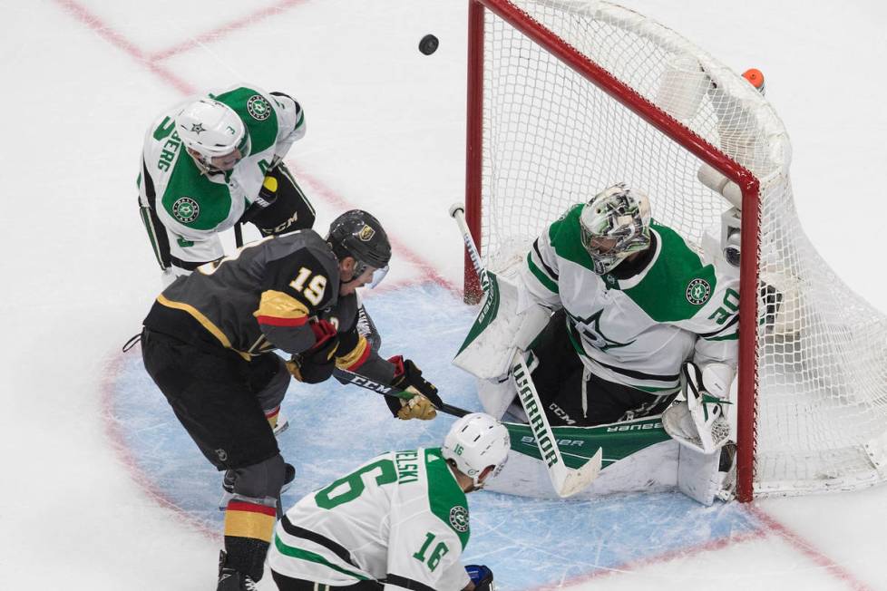 Dallas Stars goalie Ben Bishop (30) makes a save on Vegas Golden Knights' Reilly Smith (19) dur ...