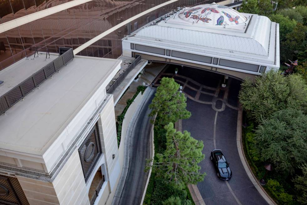 A car exits the entrance of the Encore on the Las Vegas Strip on Thursday, Aug. 6, 2020, in Las ...