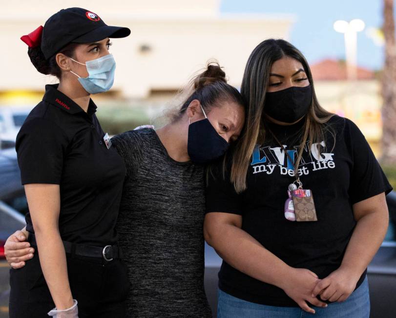 Iliana Dacosta, left, Karen Rene and Fernanda Barraza comfort each other during a vigil for Nel ...