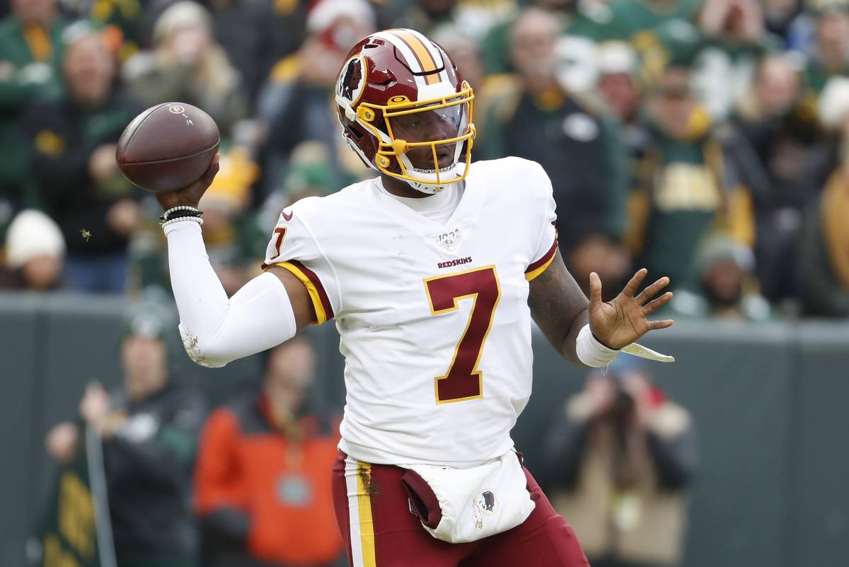 Washington Redskins' Dwayne Haskins throws during the first half of an NFL football game agains ...