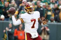Washington Redskins' Dwayne Haskins throws during the first half of an NFL football game agains ...