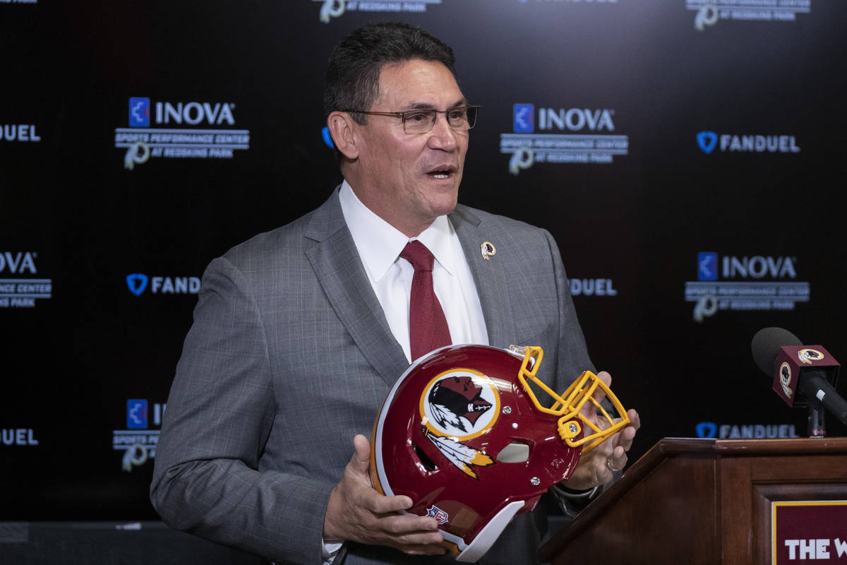 FILE - In this Jan. 2, 2020, file photo, Washington Redskins head coach Ron Rivera holds up a h ...