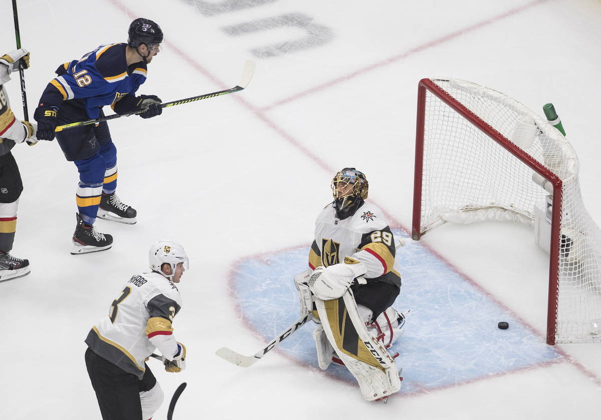 St. Louis Blues' Zach Sanford (12) watches the puck go past Vegas Golden Knights goalie Marc-An ...