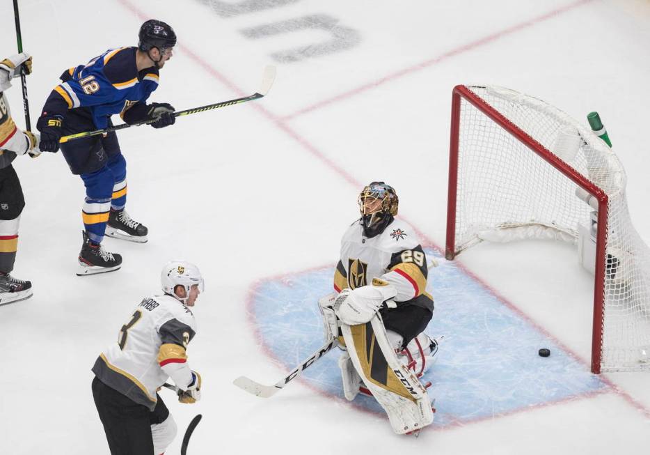 St. Louis Blues' Zach Sanford (12) watches the puck go past Vegas Golden Knights goalie Marc-An ...