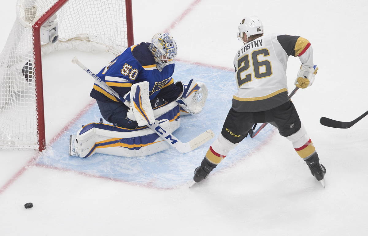 St. Louis Blues goalie Jordan Binnington (50) makes the save on Vegas Golden Knights' Paul Stas ...