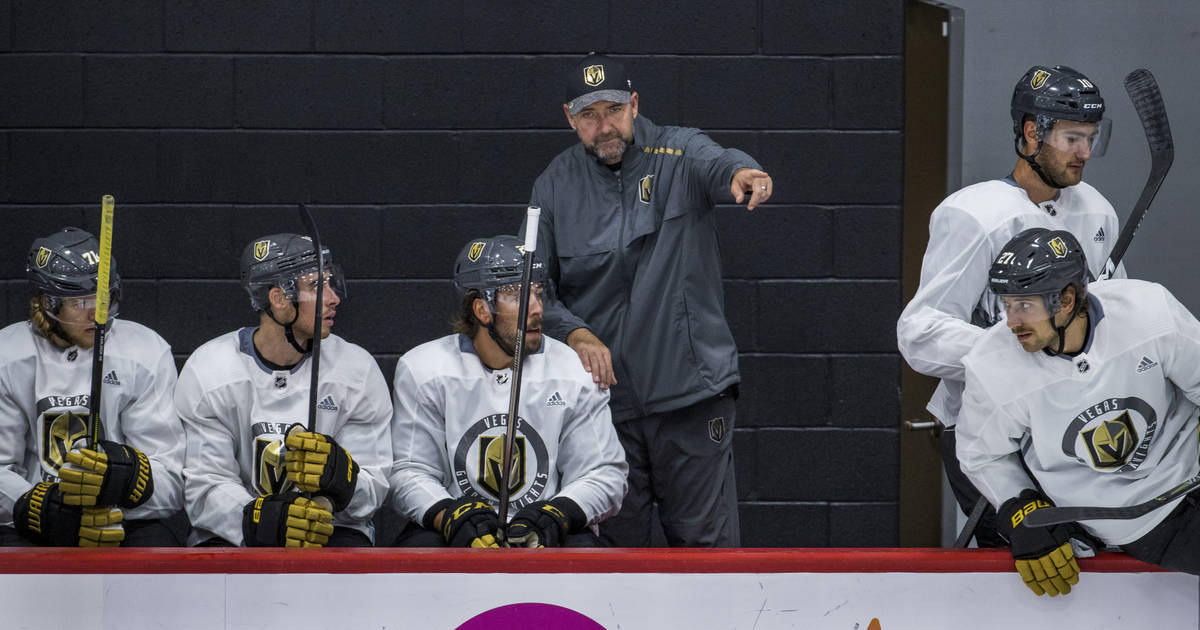 Vegas Golden Knights head coach Peter DeBoer, above, instructs center Chandler Stephenson (20, ...