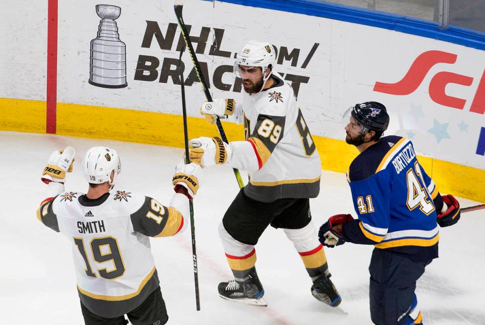 St. Louis Blues' Robert Bortuzzo (41) looks on as Vegas Golden Knights' Reilly Smith (19) and t ...