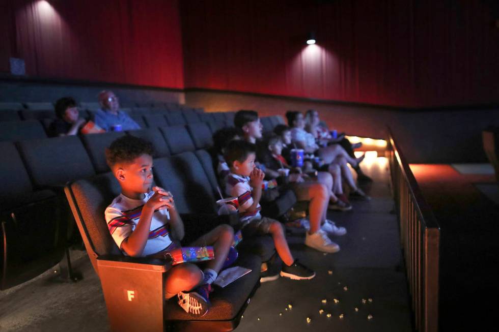 In this July 8, 2020, file photo, Zekhi Fowler sits with cousins as they watch 'Despicable Me' ...