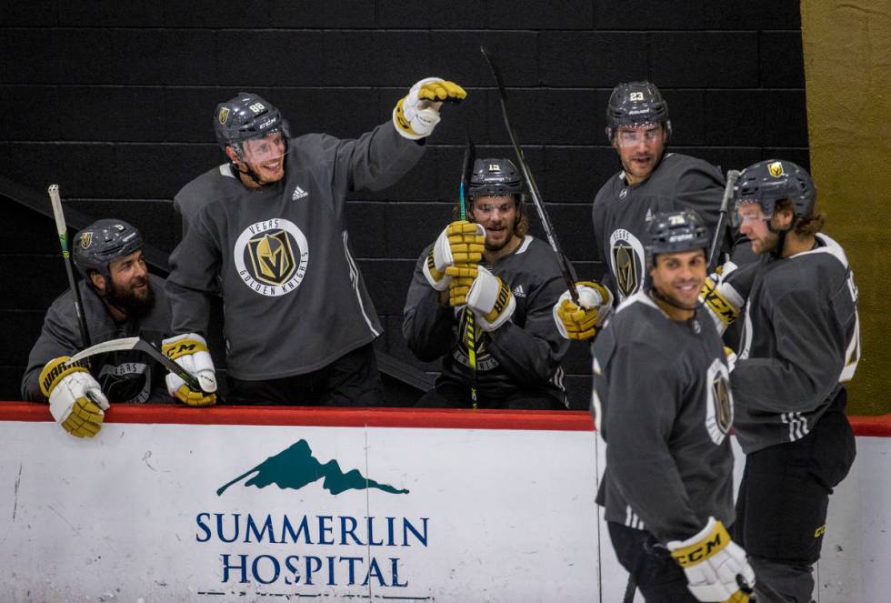 Vegas Golden Knights defenseman Nate Schmidt (88, left center) jokes around with teammates duri ...