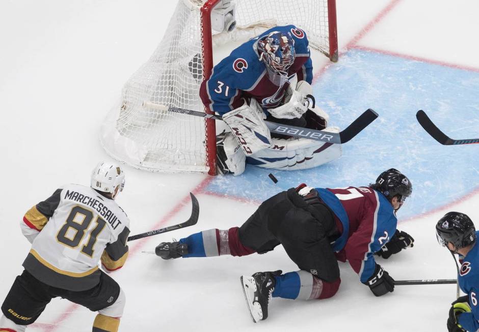 Colorado Avalanche' goalie Philipp Grubauer (31) makes the save on Vegas Golden Knights ' Jonat ...