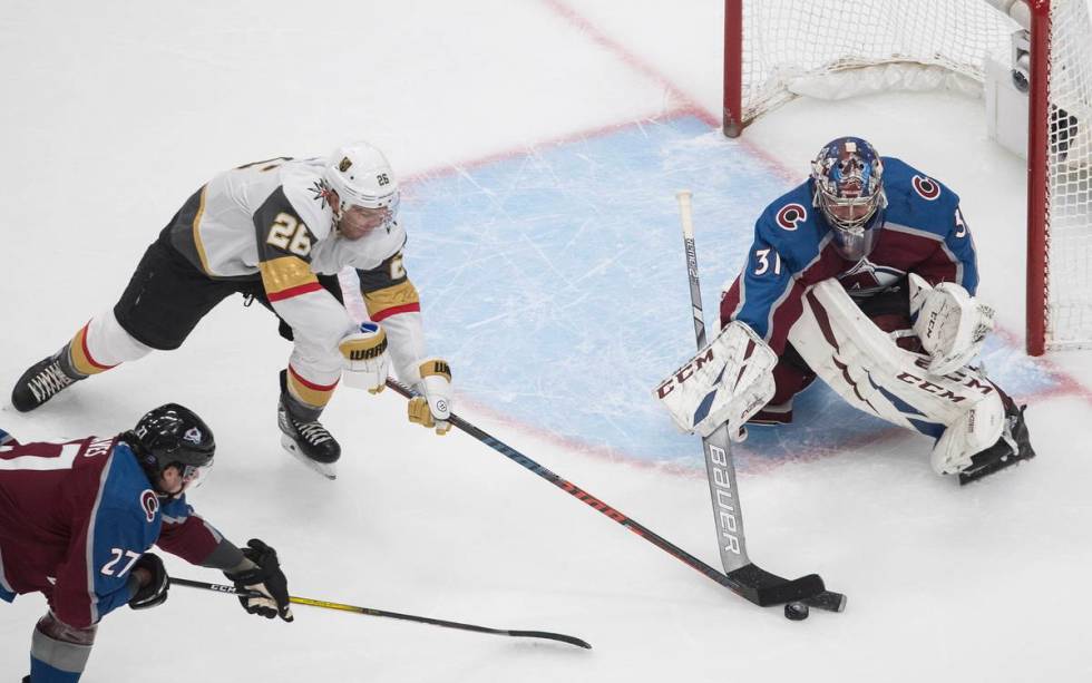 Colorado Avalanche goalie Philipp Grubauer (31) stops Vegas Golden Knights' Paul Stastny (26) d ...