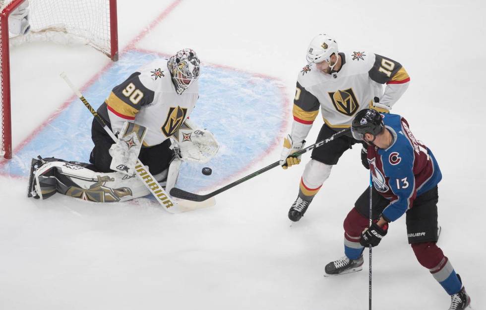 Colorado Avalanche's Valeri Nichushkin (13) is stopped by Vegas Golden Knights goalie Robin Leh ...