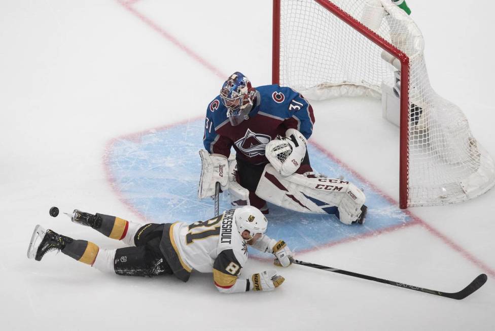 Colorado Avalanche goalie Philipp Grubauer (31) makes a save on Vegas Golden Knights' Jonathan ...