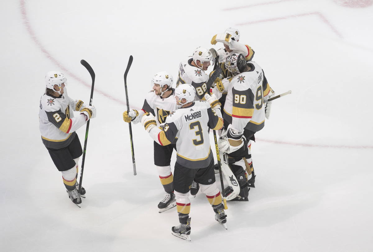 Vegas Golden Knights celebrate an overtime win over the Colorado Avalanche in an NHL hockey pla ...