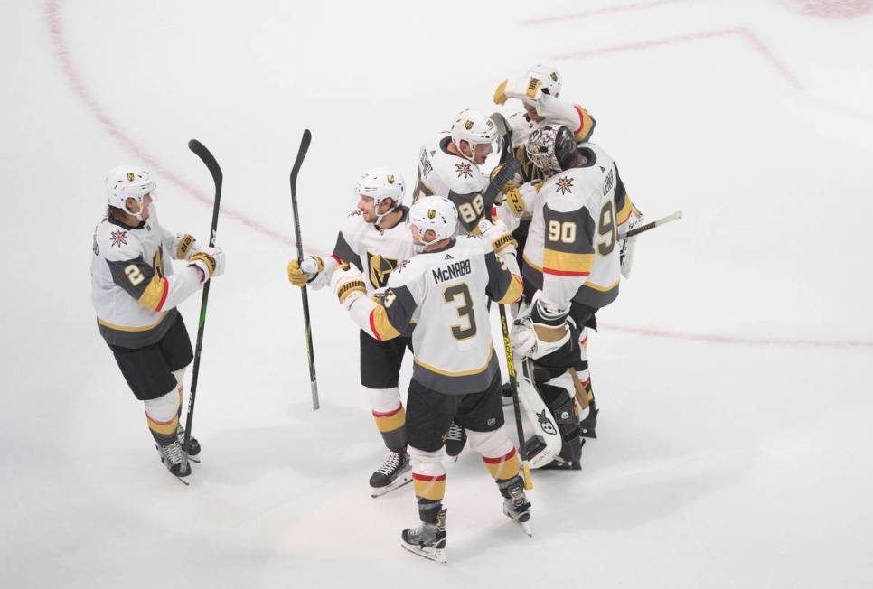Vegas Golden Knights celebrate an overtime win over the Colorado Avalanche in an NHL hockey pla ...