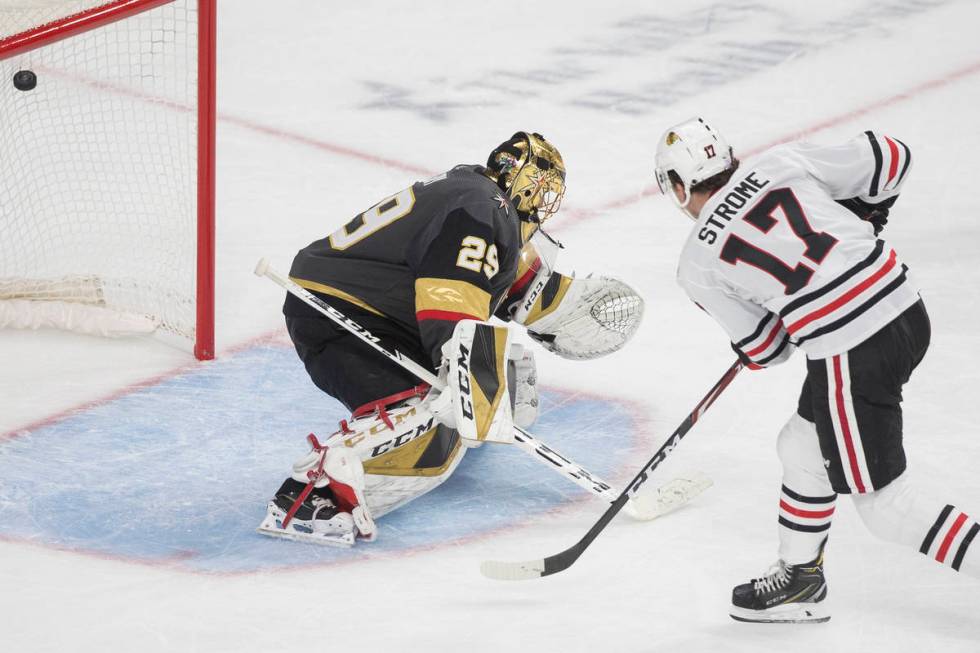 Chicago Blackhawks center Dylan Strome (17) scores on Vegas Golden Knights goaltender Marc-Andr ...