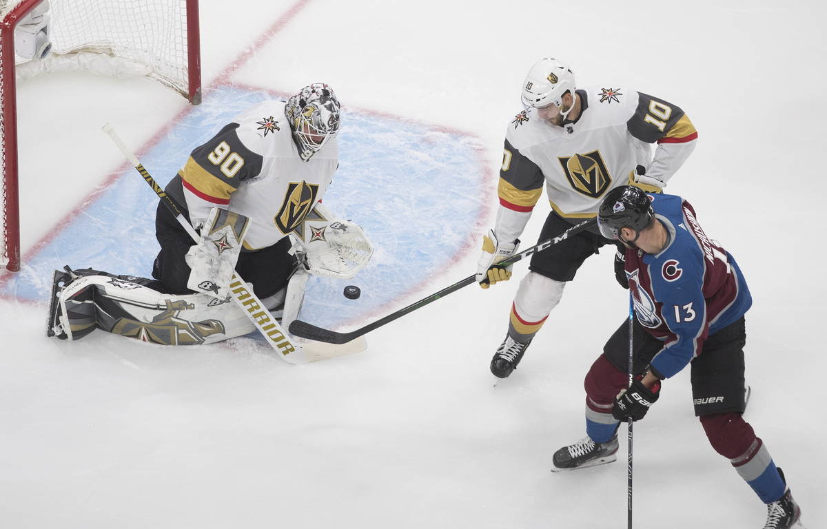 Colorado Avalanche's Valeri Nichushkin (13) is stopped by Vegas Golden Knights goalie Robin Leh ...