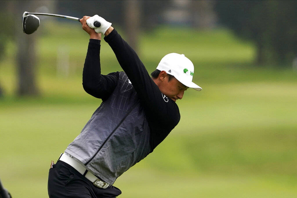 Li Haotong of China, hits his tee shot on the second hole during the third round of the PGA Cha ...
