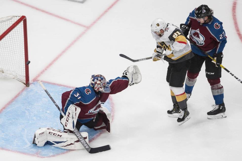 Colorado Avalanche' goalie Philipp Grubauer (31) is scored on as Vegas Golden Knights ' Jonatha ...