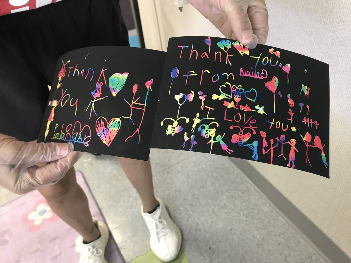 Barbara Garcia holds up two thank you cards she received from foster children on Sunday. (Photo ...