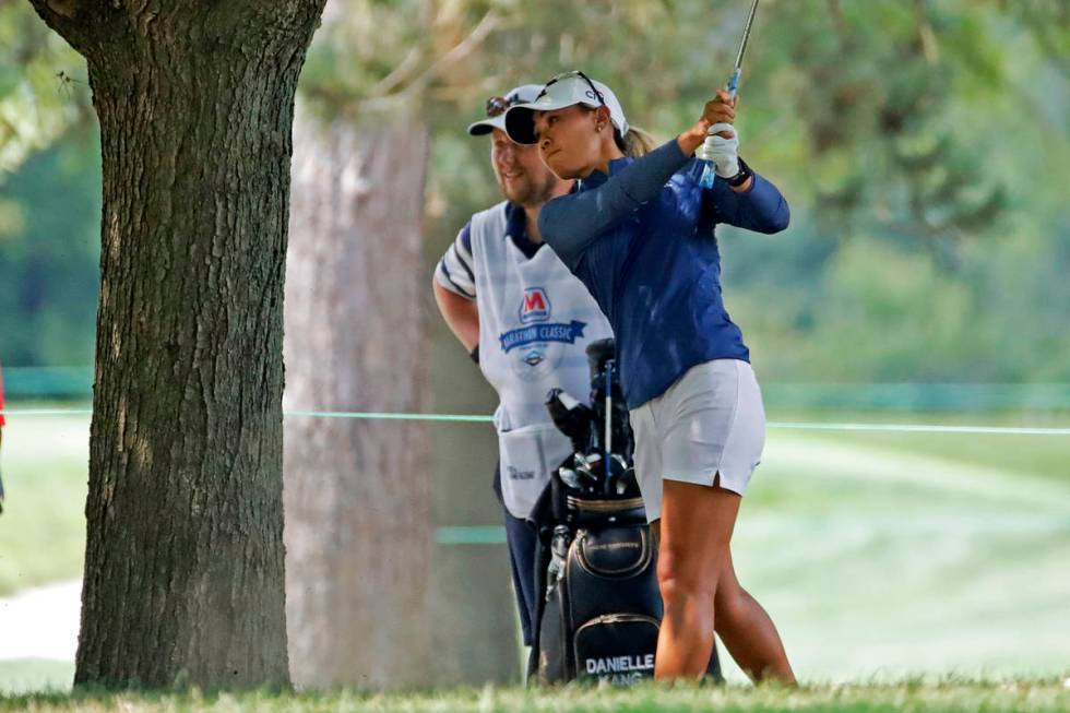 Danielle Kang hits from under a tree on the fifth fairway during the final round of the Maratho ...