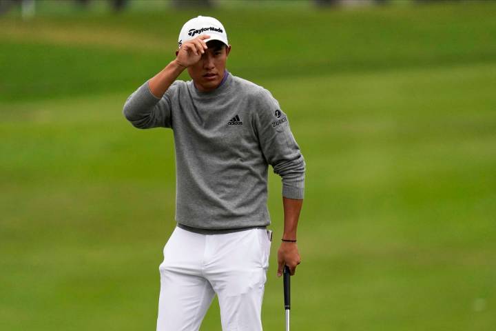 Collin Morikawa waves on the 15th hole during the final round of the PGA Championship golf tour ...