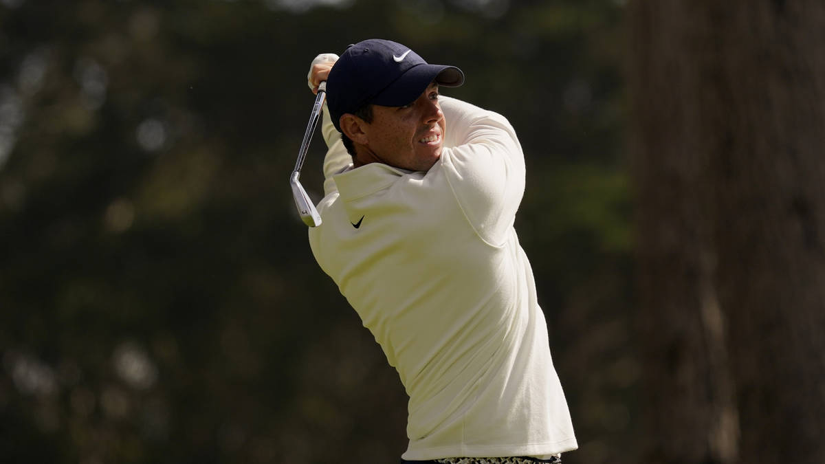 Rory McIlroy of Northern Ireland, watches his tee shot on the eighth hole during the second rou ...